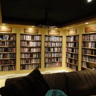 Example of a mountain style enclosed carpeted home theater design in Ottawa with yellow walls
