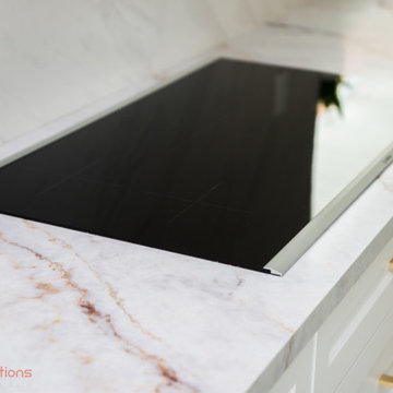 Open-Concept Linear Kitchen and Dining Area with Custom Pantry
