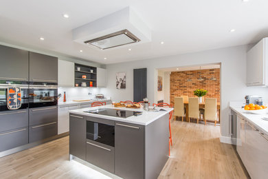 Mid-sized contemporary kitchen in Surrey.