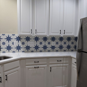 White kitchen - calcatta quartz, Salerno tile and extended cabinetry