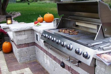 Design ideas for a large backyard brick pond in Other.