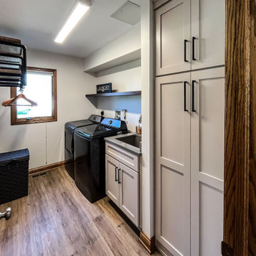 Laundry Room with Custom Cabinetry Quartz Countertop and Custom Floating Shelf