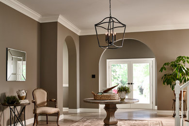 Entryway - large medium tone wood floor entryway idea in Other with beige walls and a glass front door