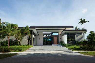Design ideas for a world-inspired house exterior in Miami.