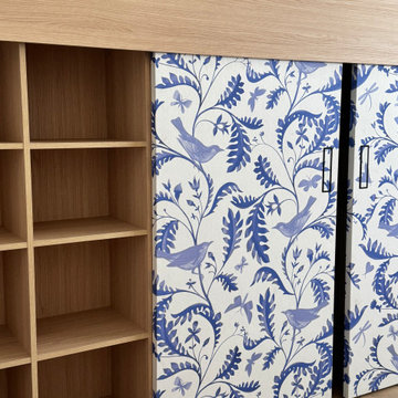 Custom Built-In Bookshelf with Blue Chinoiserie Sliding Panels