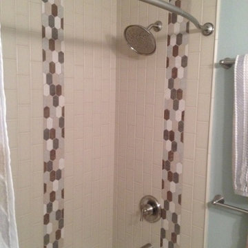Modern Tile Design Brusched Nickel Fixtures with Vertical Subway Tile