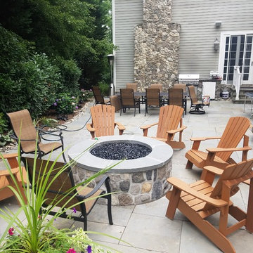 Patio with stone wall and fire pit