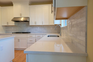 Example of a small kitchen design in Philadelphia with white backsplash and subway tile backsplash