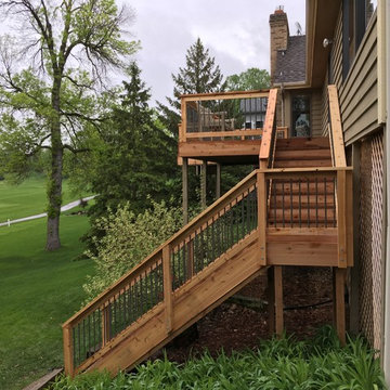 Cedar toned pressure treated deck with aluminum balusters