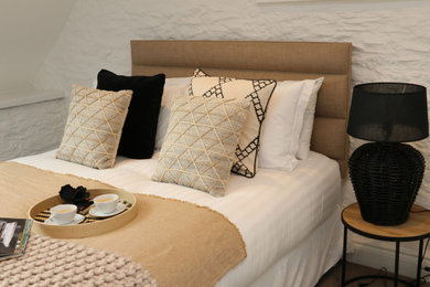 Design ideas for a medium sized contemporary master bedroom in Devon with white walls, carpet and grey floors.