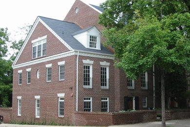 Elegant three-story brick exterior home photo in DC Metro