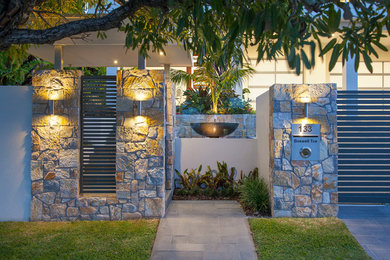 This is an example of a mid-sized contemporary front door in Brisbane.
