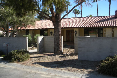 Example of a tuscan exterior home design in Other
