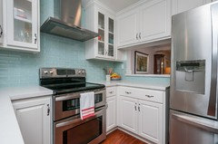Glass subway tile kitchen