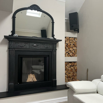 Traditional Fireplace Surround With Modern Inset Wood-Burning Stove