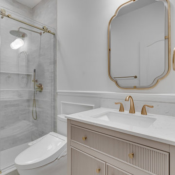 White Bathroom With Golden Finishes