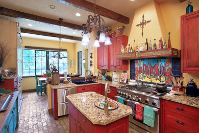 Design ideas for a kitchen in Tampa with stainless steel appliances, a drop-in sink, raised-panel cabinets, multi-coloured splashback, brick floors and medium wood cabinets.