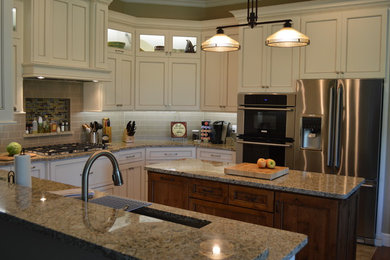 Inspiration for a mid-sized timeless u-shaped ceramic tile and brown floor open concept kitchen remodel in Other with an undermount sink, beaded inset cabinets, white cabinets, granite countertops, gray backsplash, subway tile backsplash, stainless steel appliances, an island and gray countertops
