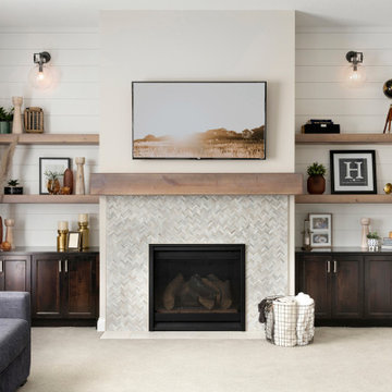 The Nantucket | Shiplap Wainscoting</p><p>A warm and inviting great room implemented through white shiplap, floating shelves and dark wood built-ins for additional contrast. Photos by Spacecrafting Photography. </p><p><img decoding=