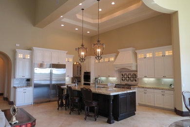 Photo of a transitional eat-in kitchen in Phoenix with with island.