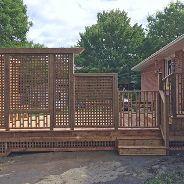 Brown Treated Wood Deck with Custom Privacy Wall and Custom Bench