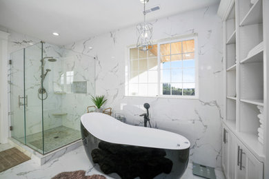 Example of a large porcelain tile and white floor corner shower design in Portland with a hot tub and a hinged shower door