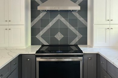 Enclosed kitchen - mid-sized contemporary u-shaped porcelain tile and gray floor enclosed kitchen idea in Seattle with a single-bowl sink, shaker cabinets, white cabinets, quartz countertops, blue backsplash, porcelain backsplash, stainless steel appliances, an island and white countertops
