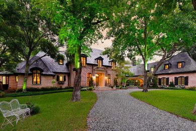French country brick exterior home idea in Dallas