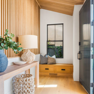 The light-filled foyer and bench nook in the entranceway.