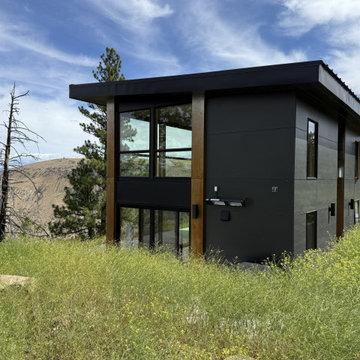 ADU cabin nestled into the hillside with valley view