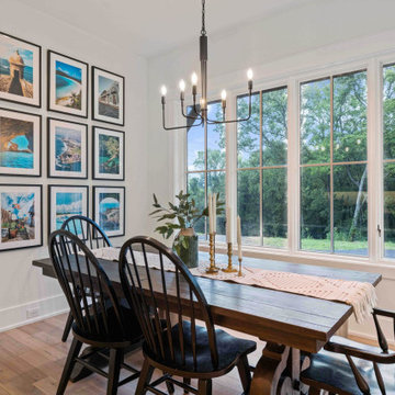 Elegant Modern Farmhouse Dining Room: Travel Gallery Wall, Rustic Table, and Pan
