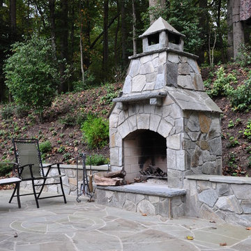 Chocolate Grey Outdoor Fireplace and Seating wall with Pennsylvania Blue Patio