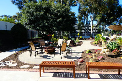 Large traditional backyard patio in San Diego with a fire feature, concrete slab and no cover.