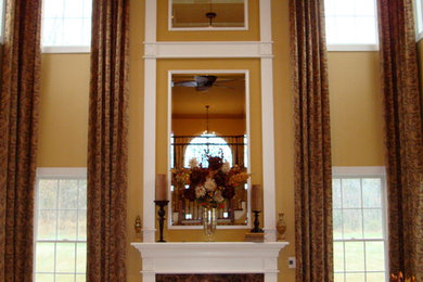 Example of a huge classic formal and open concept carpeted living room design in New York with yellow walls, a standard fireplace, a plaster fireplace and no tv