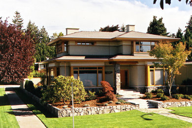 Large trendy gray two-story mixed siding house exterior photo in Vancouver with a gambrel roof