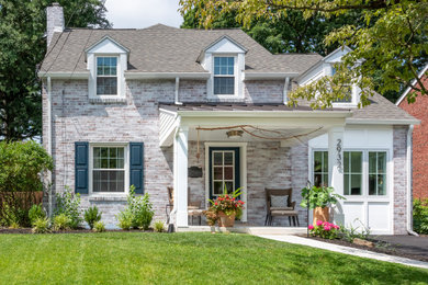 Inspiration for a transitional two-story brick house exterior remodel in Philadelphia with a shingle roof
