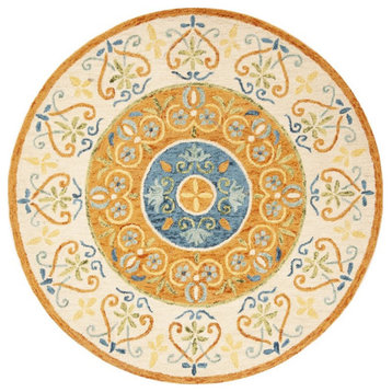 Safavieh Novelty 5' Round Hand Tufted Wool Rug in Gold and Ivory