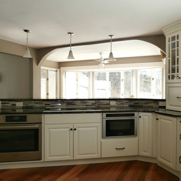 Traditional White Kitchen Remodel with Cook top in the peninsula