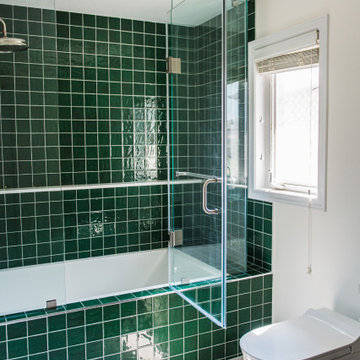 Vibrant Green Ceramic Tiles Bring Life to a Hallway Bathroom