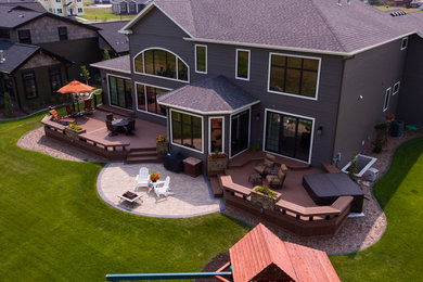 Large trendy backyard deck photo in Other with a fire pit and no cover