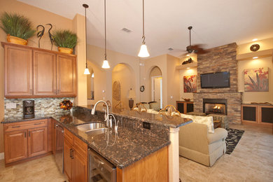 Huge elegant l-shaped ceramic tile kitchen photo in Orlando with a double-bowl sink, raised-panel cabinets, medium tone wood cabinets, granite countertops, beige backsplash, matchstick tile backsplash and stainless steel appliances