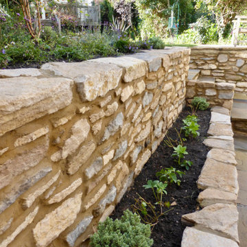 Traditional cottage garden with natural stone walling