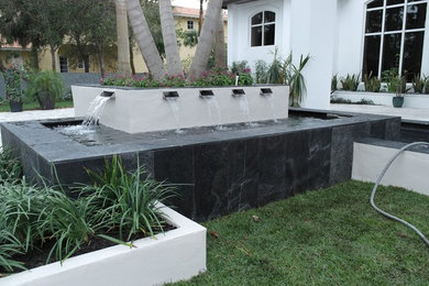 Mid-sized elegant white two-story stucco exterior home photo in Miami