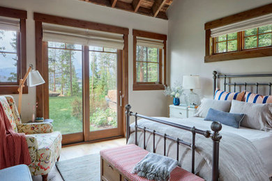 Example of a large classic master wood wall bedroom design in Denver