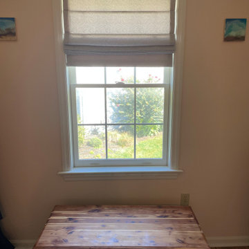 Cordless Roman shades and custom seat cushions for dormer windows