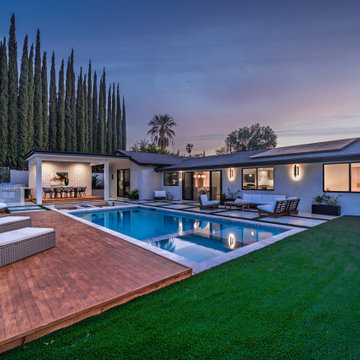 Backyard at Dusk with the Pool and Patio Lit