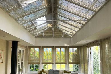 Design ideas for a modern conservatory in Hampshire with feature lighting.