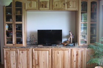 Inspiration for a small rustic open concept home theater remodel in Seattle with white walls