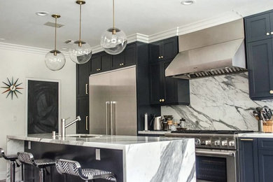 Kitchen in Los Angeles with marble benchtops and with island.