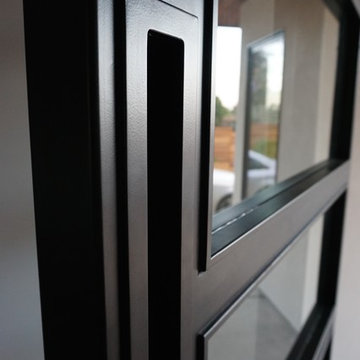 Steel Pivot Door - Stevens Residence